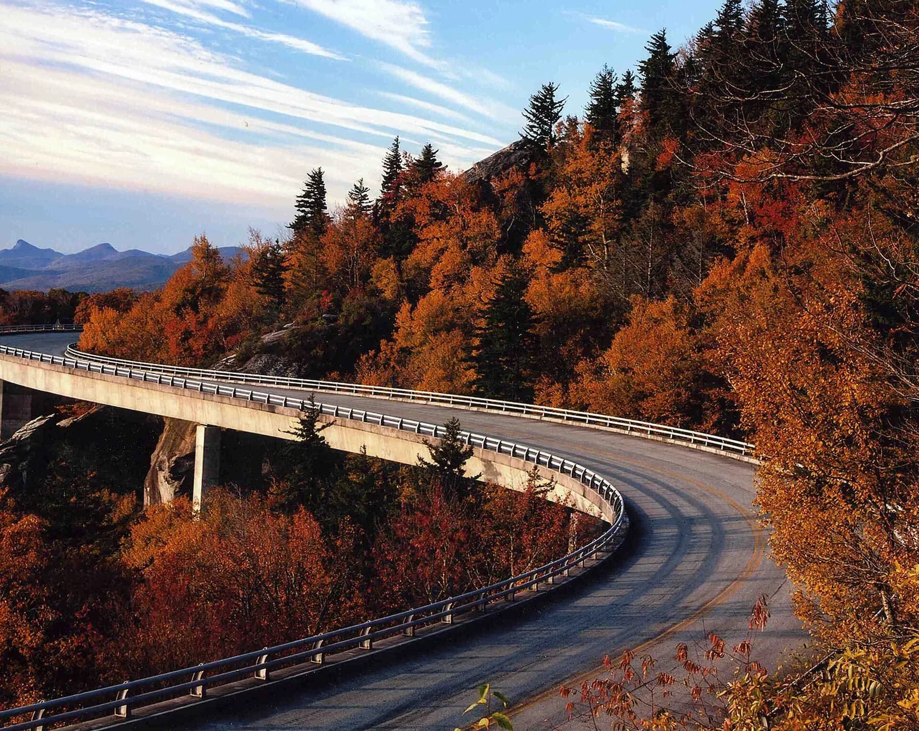The Linn Cove Viaduct on the Blue Ridge Parkway wrapping around Grandfather Mountain in fall color